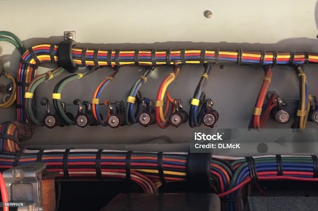 Marine wiring harness with color-coded cables and fuse holders